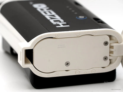 Bottom view of the rear-mount battery case showing the base plate and visible screw mounts