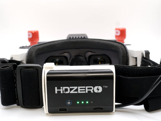 HDZero Rear-Mount Battery Case installed on HDZero FPV goggles, front view with LED battery indicators