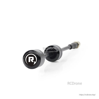 Close-up angled view of antenna head marked 'R' with coax lead and SMA connector in background
