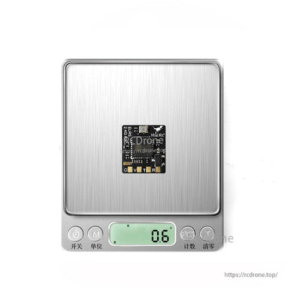 Receiver PCB on digital scale showing 0.6 weight reading
