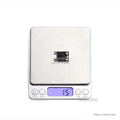 Receiver board on digital scale showing 1.5 g weight