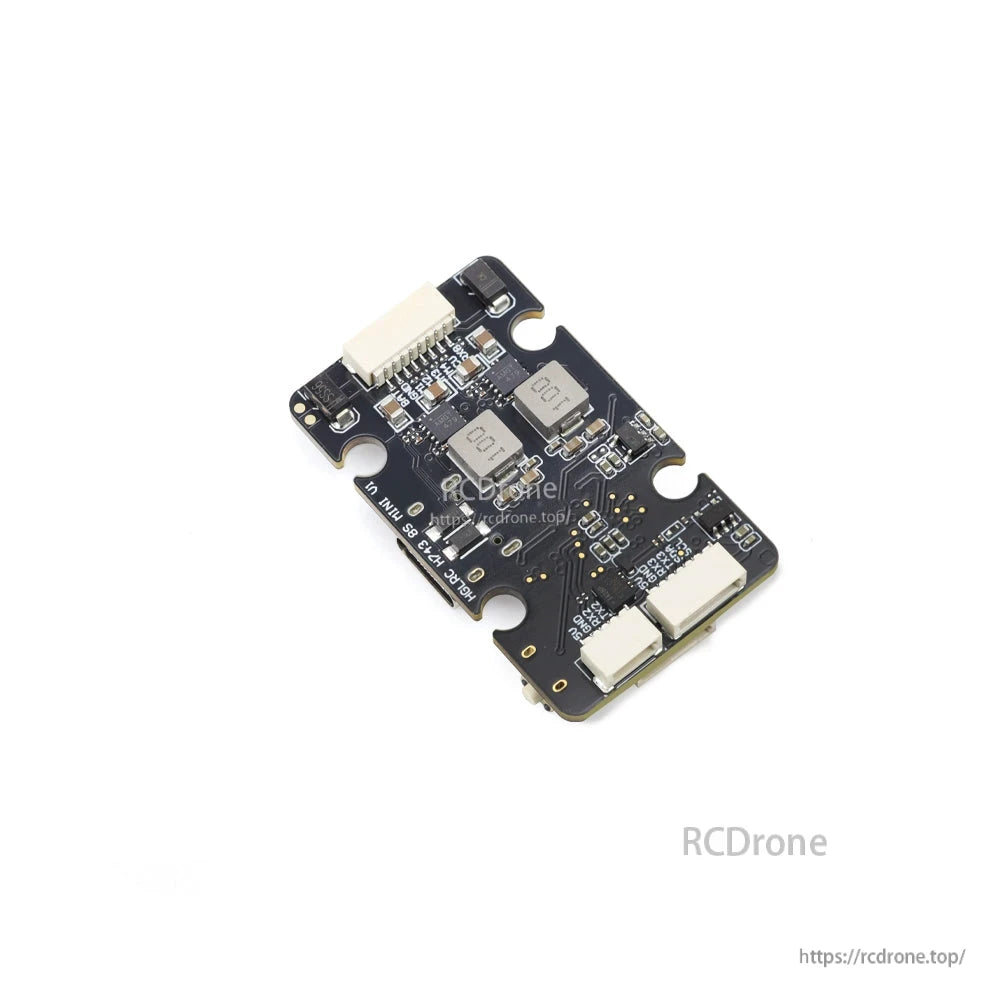 HGLRC FC board angled view showing dual inductors and JST plug layout