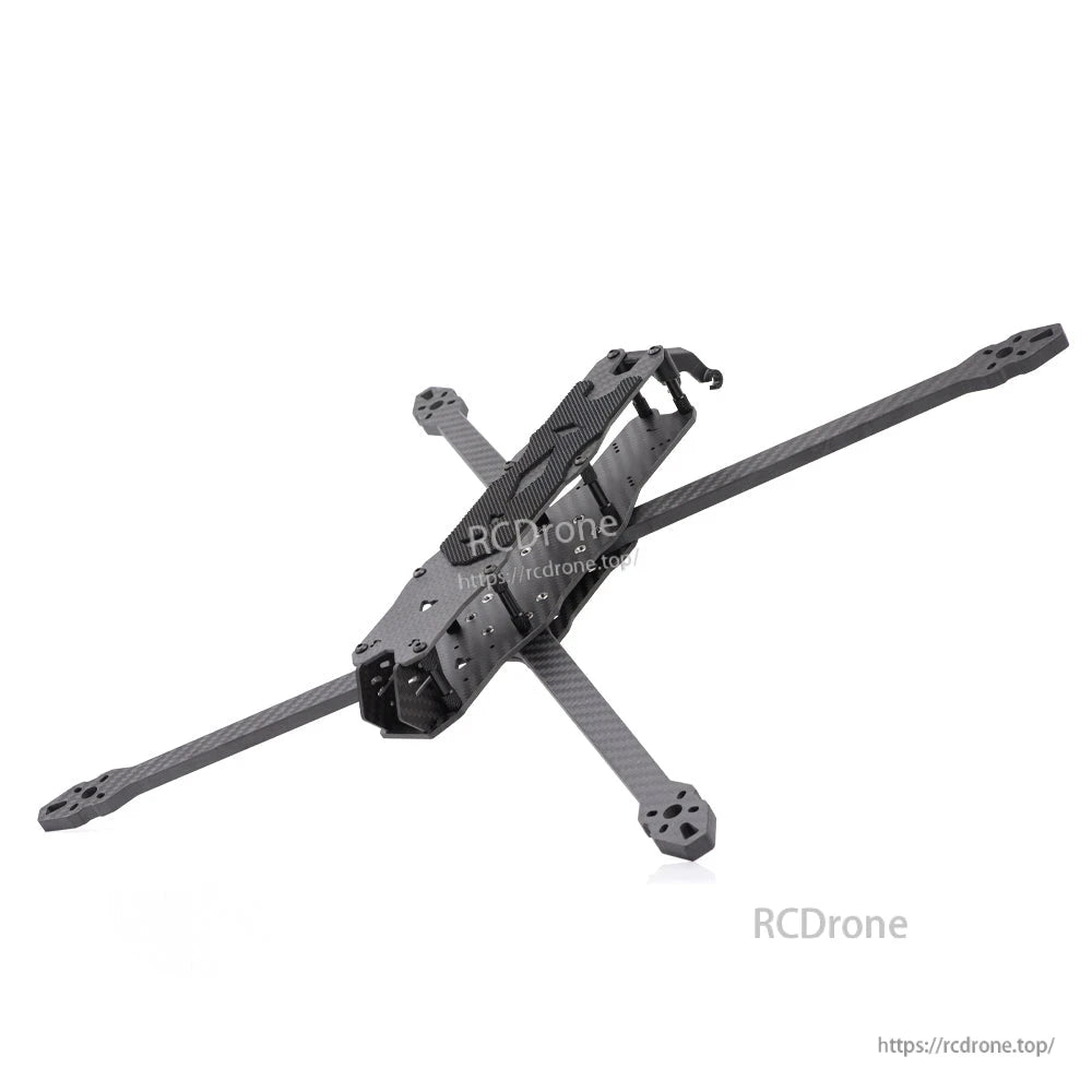 Angled rear-top view of carbon fiber quad frame showing arm ends and top plate texture