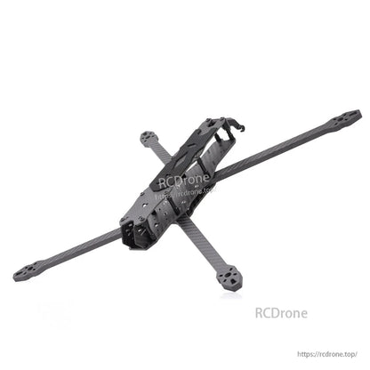 Angled rear-top view of carbon fiber quad frame showing arm ends and top plate texture