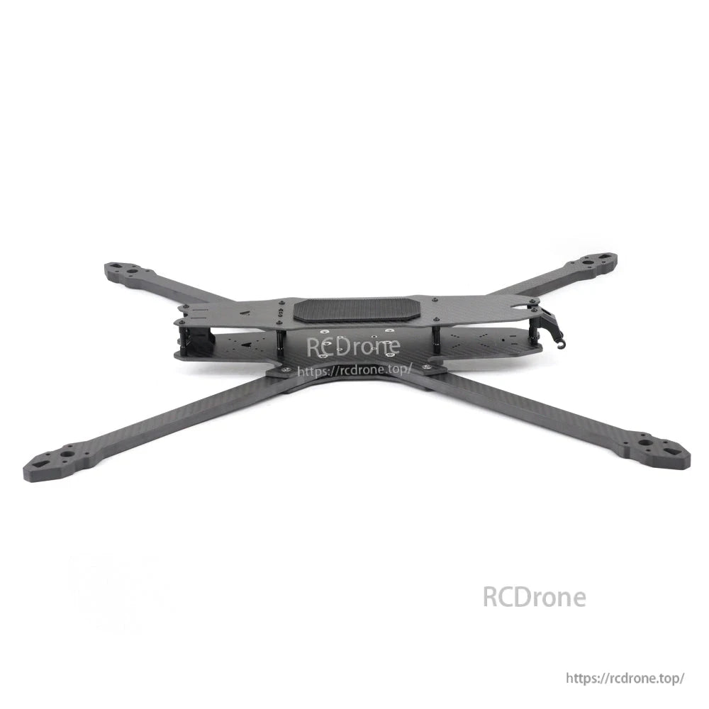 Side profile of assembled FPV frame showing low-slung center stack and carbon fiber arms