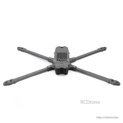 Low front view of carbon fiber FPV drone frame with extended arms and center plate