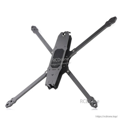 Angled top view of carbon fiber FPV frame showing stacked center plates and arm mounting points