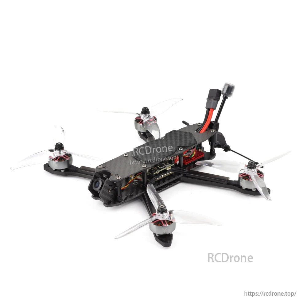Front-right angle view of the quadcopter showing carbon frame, side electronics stack area, and propellers