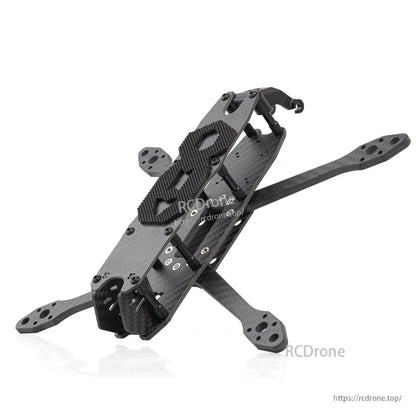 Angled side view of carbon fiber FPV frame highlighting arm geometry and front camera mount
