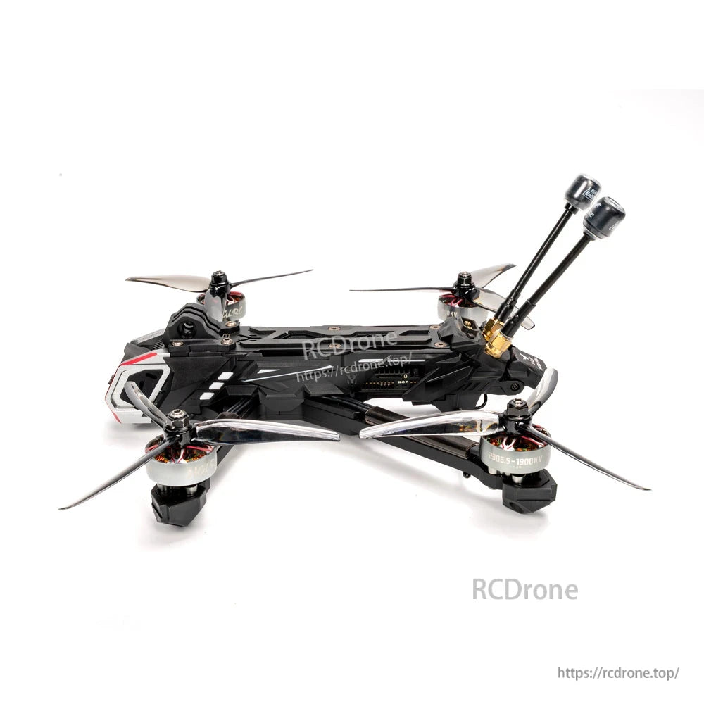 Low side profile view of FPV drone showing top plate, wiring layout, and rear dual antennas