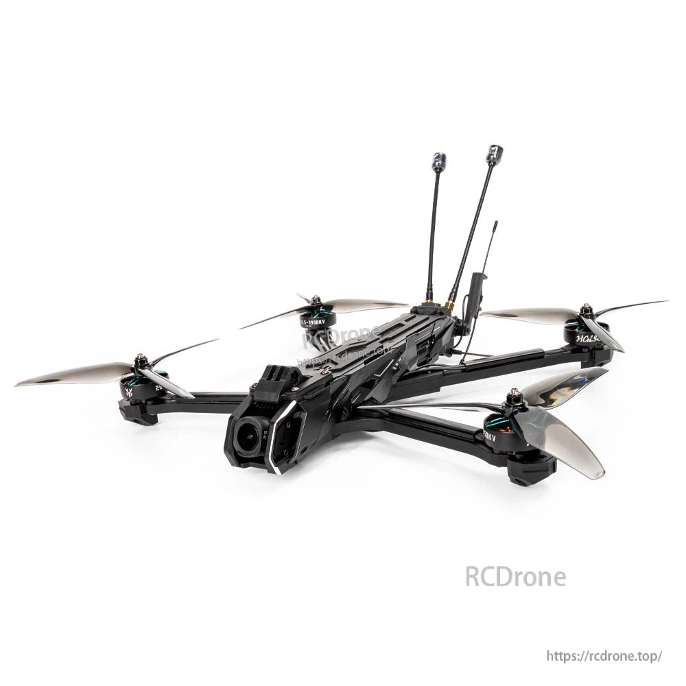 Low-angle product photo highlighting carbon frame, front camera pod, 7-inch propellers and rear antenna mounts