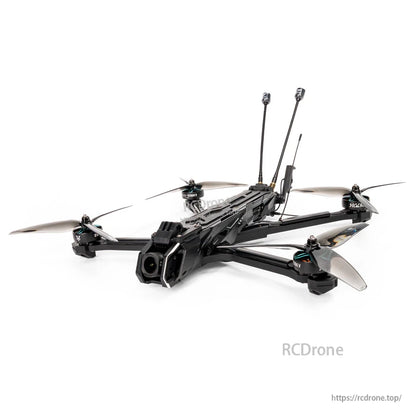 Low-angle product photo highlighting carbon frame, front camera pod, 7-inch propellers and rear antenna mounts