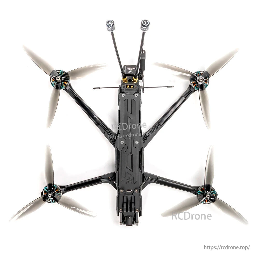 Top-down view of 7-inch FPV quadcopter frame layout with four propellers, electronics bay and rear antennas
