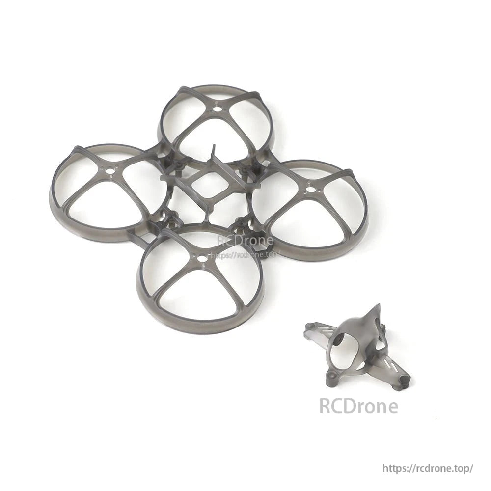 Petrel 75Whoop V2 frame and canopy parts shown side by side, transparent gray plastic