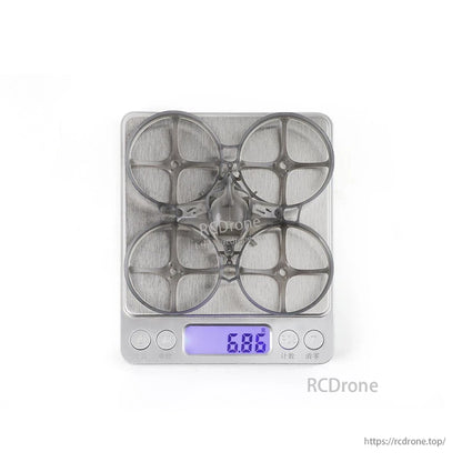 Frame and canopy weight shown on digital scale reading 6.86 g
