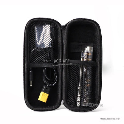 Open carrying case with mesh pockets holding the soldering iron handle, tip and power cable