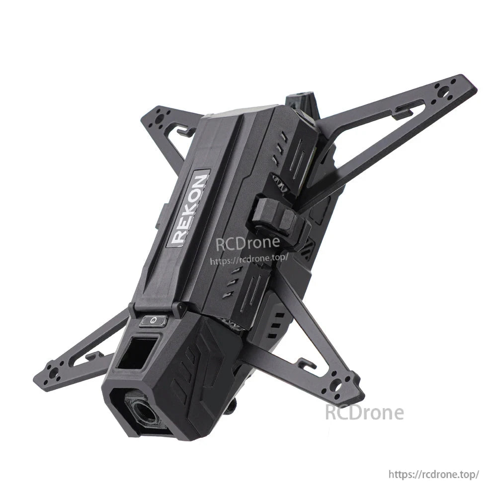 Angled close view of frame top shell with REKON logo, front camera opening and carbon fiber arms