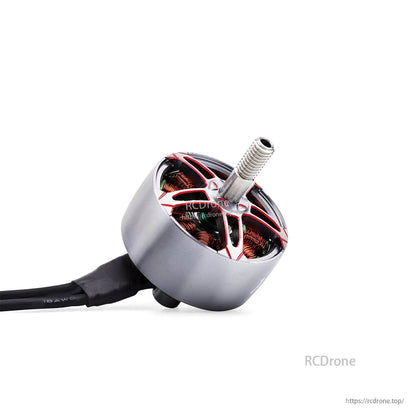 Close-up angled view of motor bell, copper windings, and wire exit with heat shrink