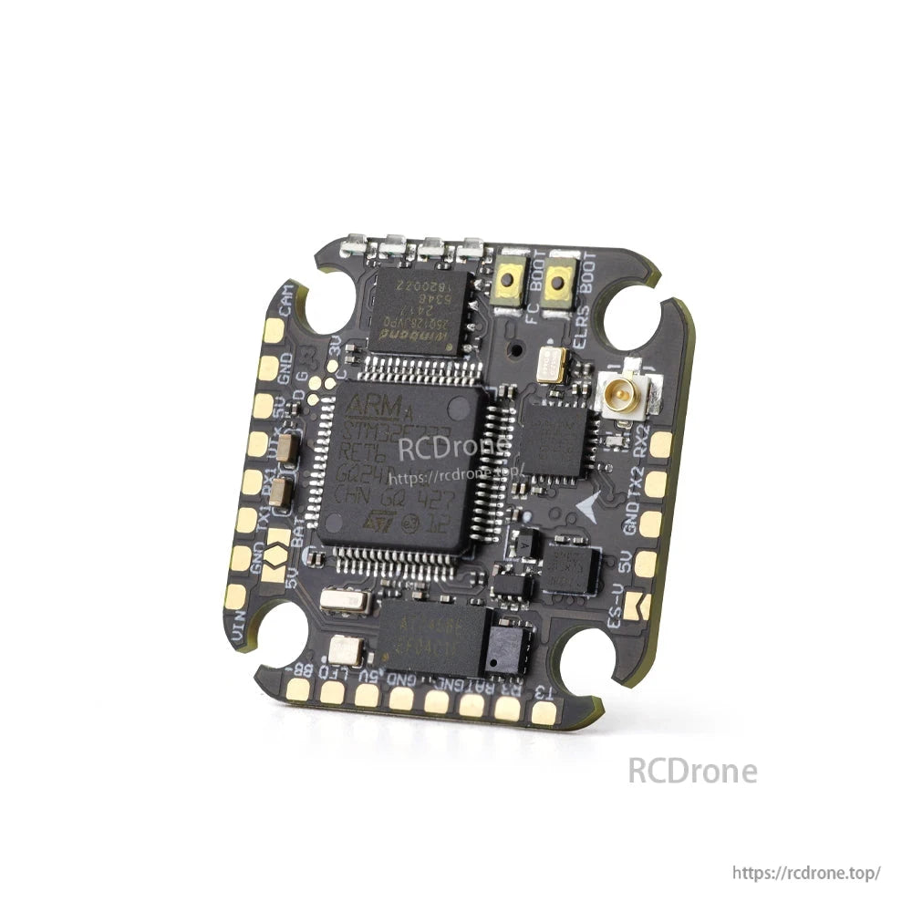 Angled close-up of flight controller PCB showing boot pads and U.FL antenna connector location
