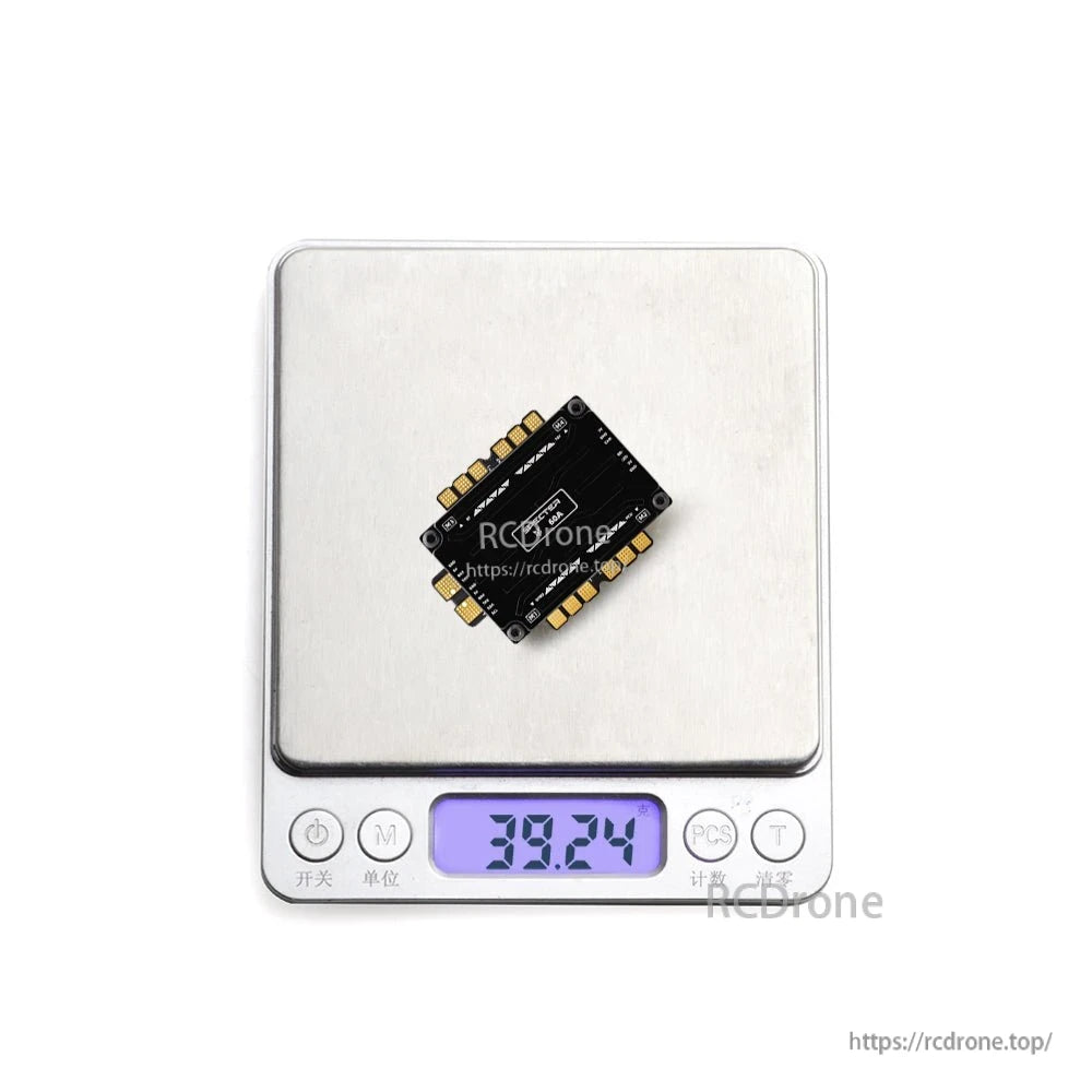 HGLRC SPECTER F760 BOX integrated stack on digital scale showing weight reading 38.24 g