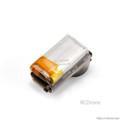 Side angle view of buzzer showing battery cell under clear heatshrink and connector end
