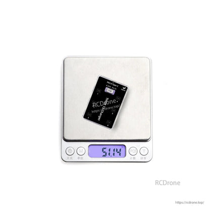 Charger shown on digital scale with weight reading around 51.14 g