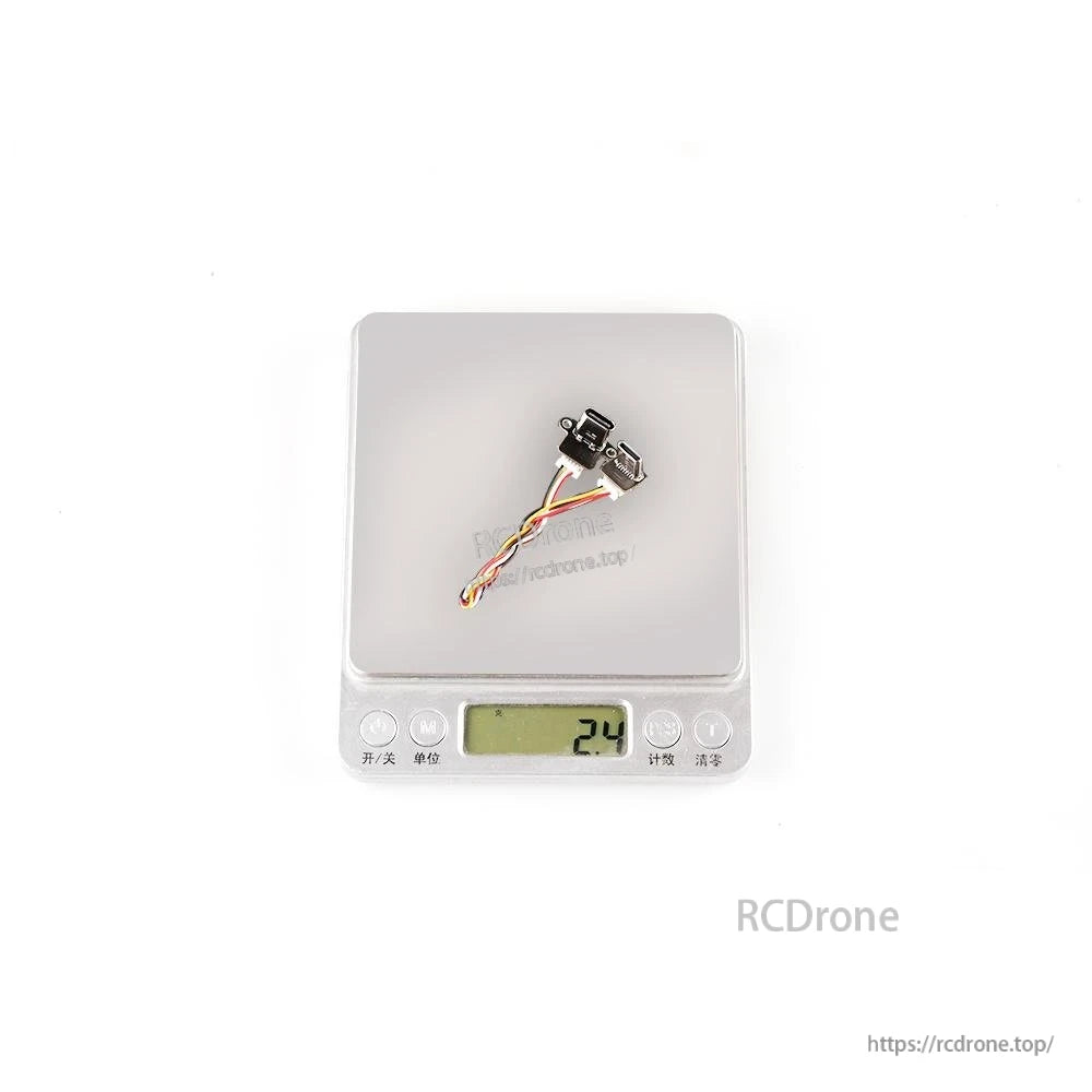 Tuning adapter module with cable on digital scale showing 24 reading