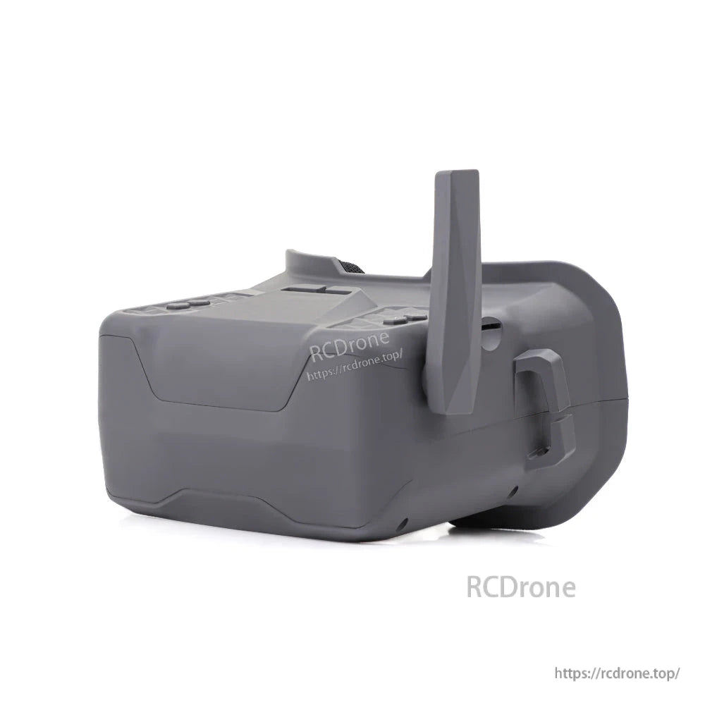 Rear side view of FPV goggle with upright antenna, showing shell contours and strap slot