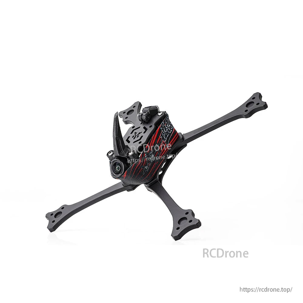Angled front view of assembled racing drone frame showing camera opening, top plate cutouts, and arm ends