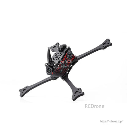 Angled front view of assembled racing drone frame showing camera opening, top plate cutouts, and arm ends