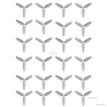 HQ 40MMX3 40mm 3-Blade Propeller, Set of grey HQ 40mm 3-blade micro drone propellers laid out in a grid on a white background