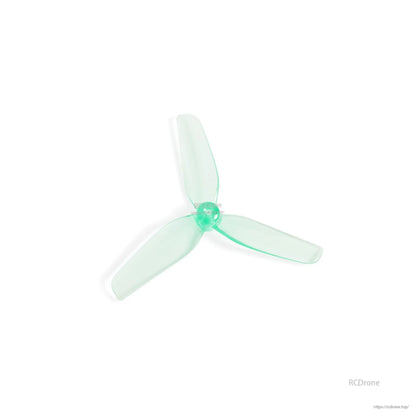 Angled close-up of translucent aquamarine tri-blade propeller showing hub detail and curved blades