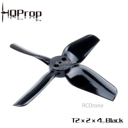 Close-up of black 4-blade drone propeller with three mounting holes in the center hub