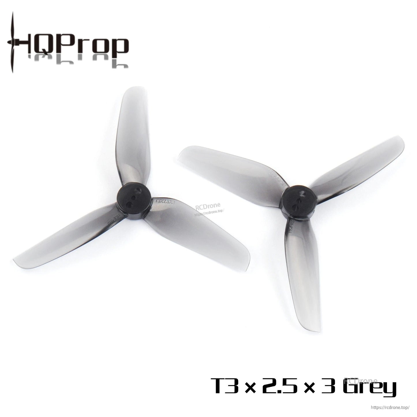 Pair of grey 3-inch tri-blade drone propellers laid out side by side, hubs facing up