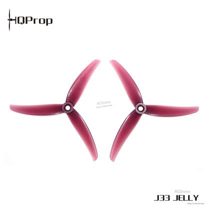 HQProp J33 JELLY red 3-blade propellers, two pieces on white background