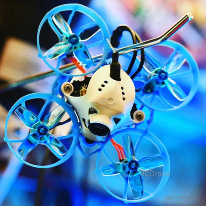 Translucent blue 4-blade props installed on a blue ducted micro whoop FPV quad
