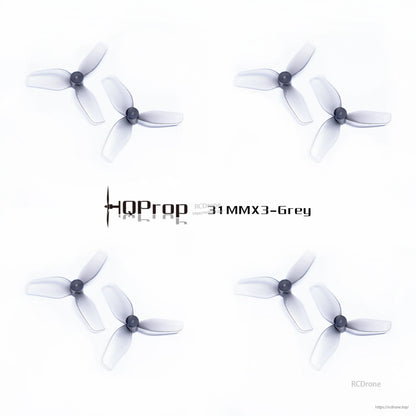 Four HQProp 31MMX3 grey tri-blade props set arranged in grid
