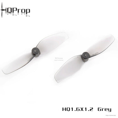Pair of HQProp 1.6x1.2 grey 2-blade whoop propellers shown side by side