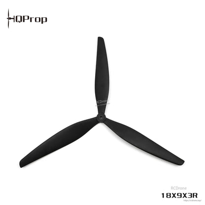 Black 18X9X3R tri-blade propeller, top view with hub detail centered