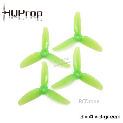 3x4x3 tri-blade propellers set of four in green, flat lay showing hub and blades