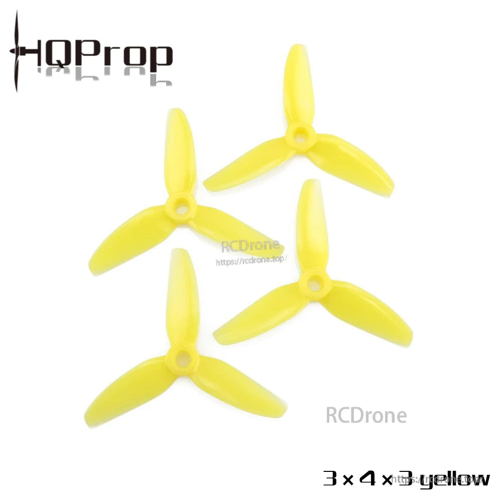 3x4x3 tri-blade propellers 4-pack in yellow, top-down view showing all four props