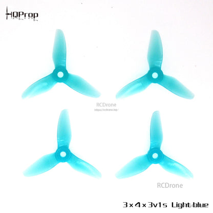 Light blue 3-blade polycarbonate propellers, four-piece set displayed from top view
