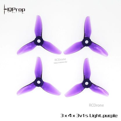 Light purple tri-blade propellers with 5mm center bore, four props shown (two CW and two CCW)
