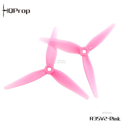 R35V2 pink 3-blade propeller pair, top view showing translucent polycarbonate blades