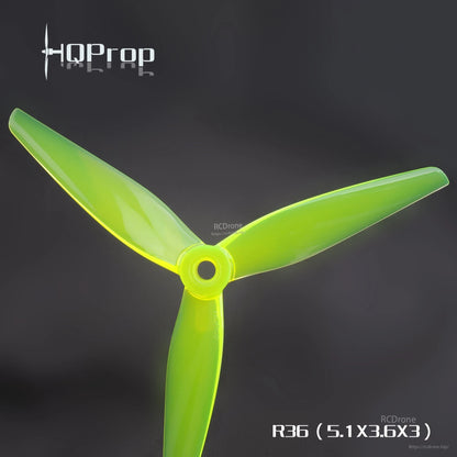 Neon green translucent tri-blade propeller close-up on dark background, R36 (5.1x3.6x3) text