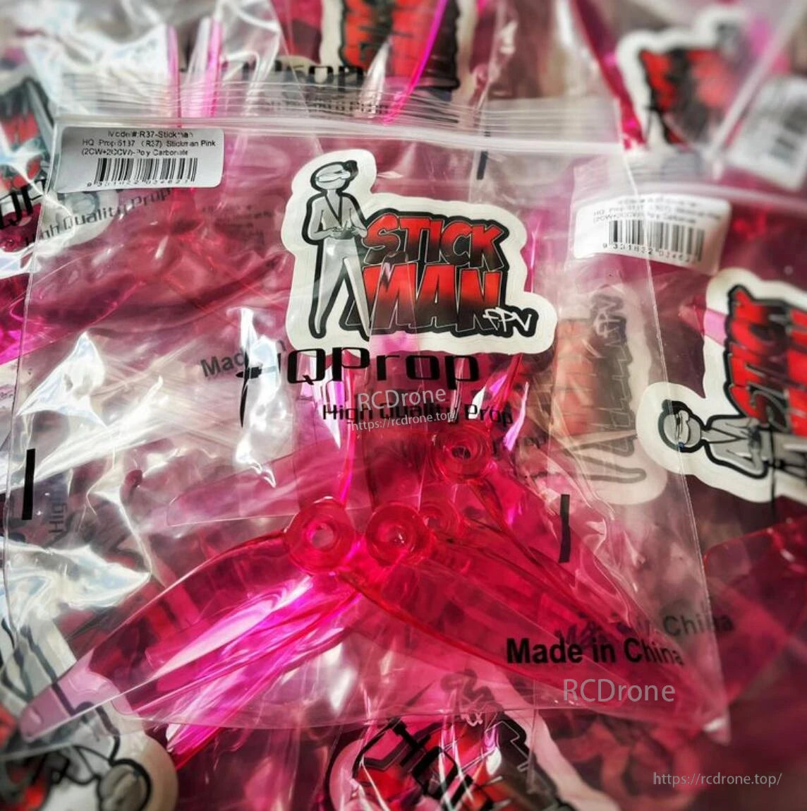Bagged pink HQProp propellers with Stickman logo label and barcode, package contents view