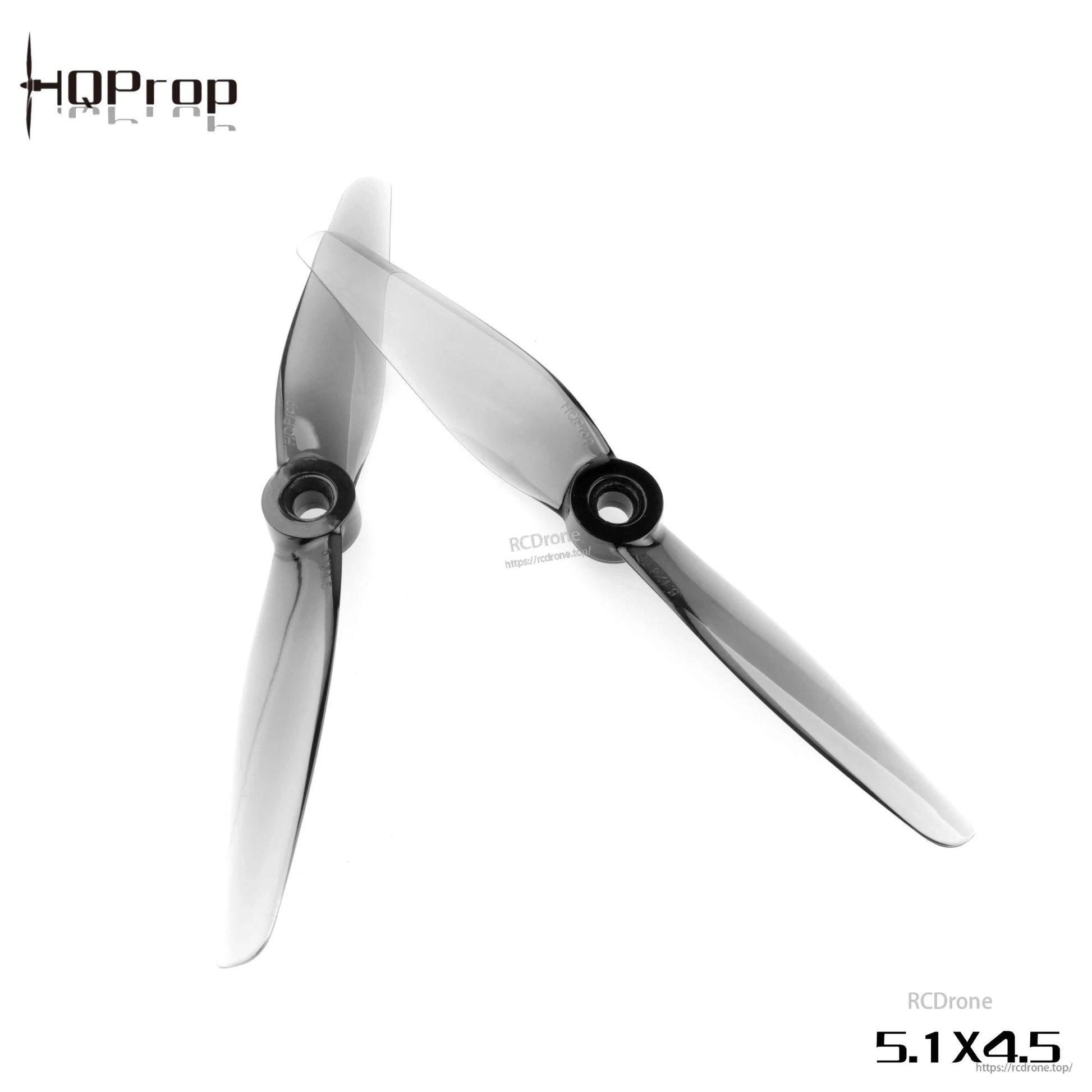 Pair of grey translucent 2-blade drone propellers angled on white, showing curved blades and round hubs