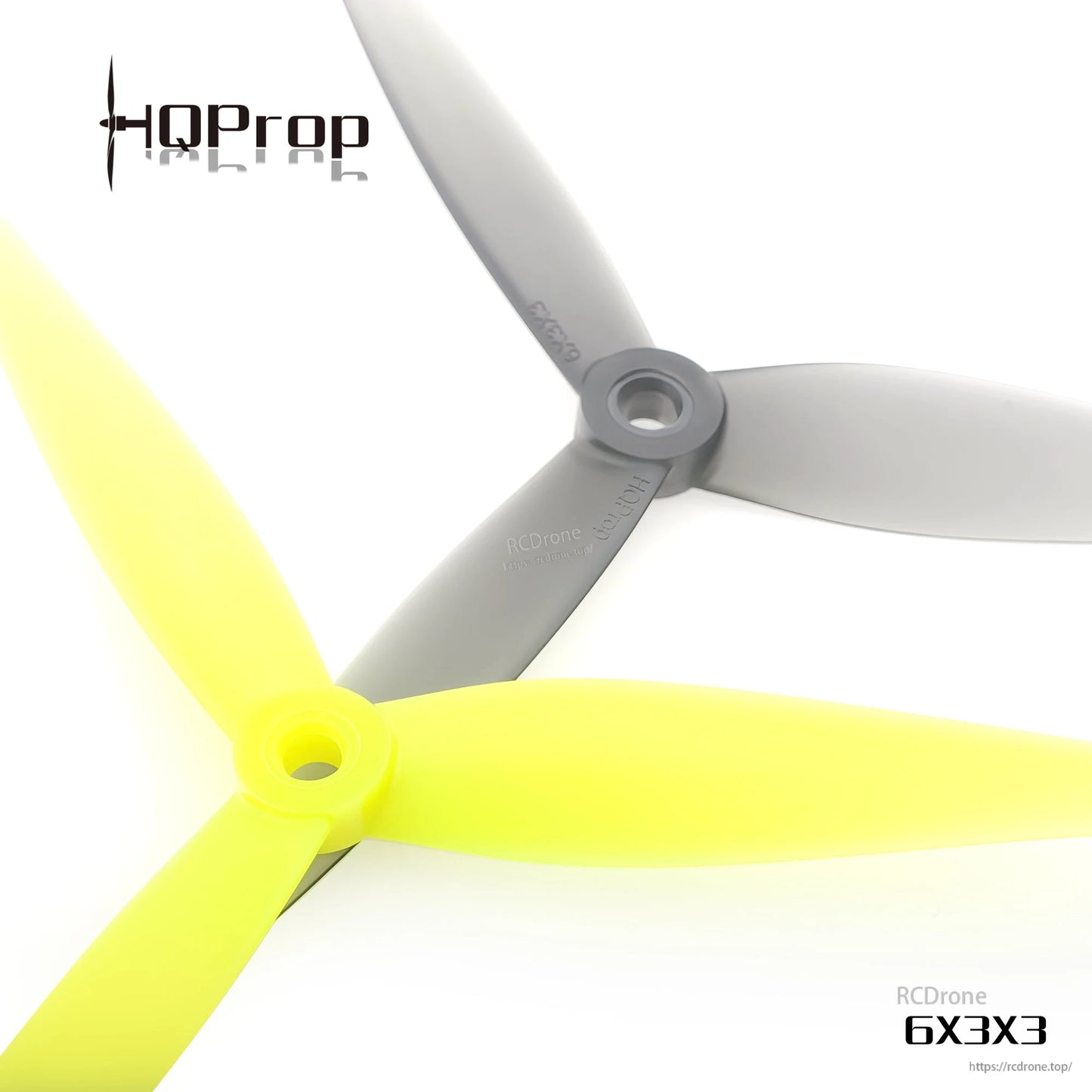 Close-up of 6X3X3 three-blade prop hubs showing center mounting hole, gray and yellow props
