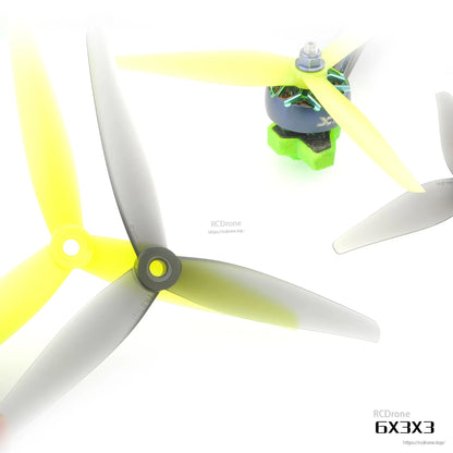 6X3X3 3-blade propellers shown mounted on a drone motor, gray and yellow props for fit reference