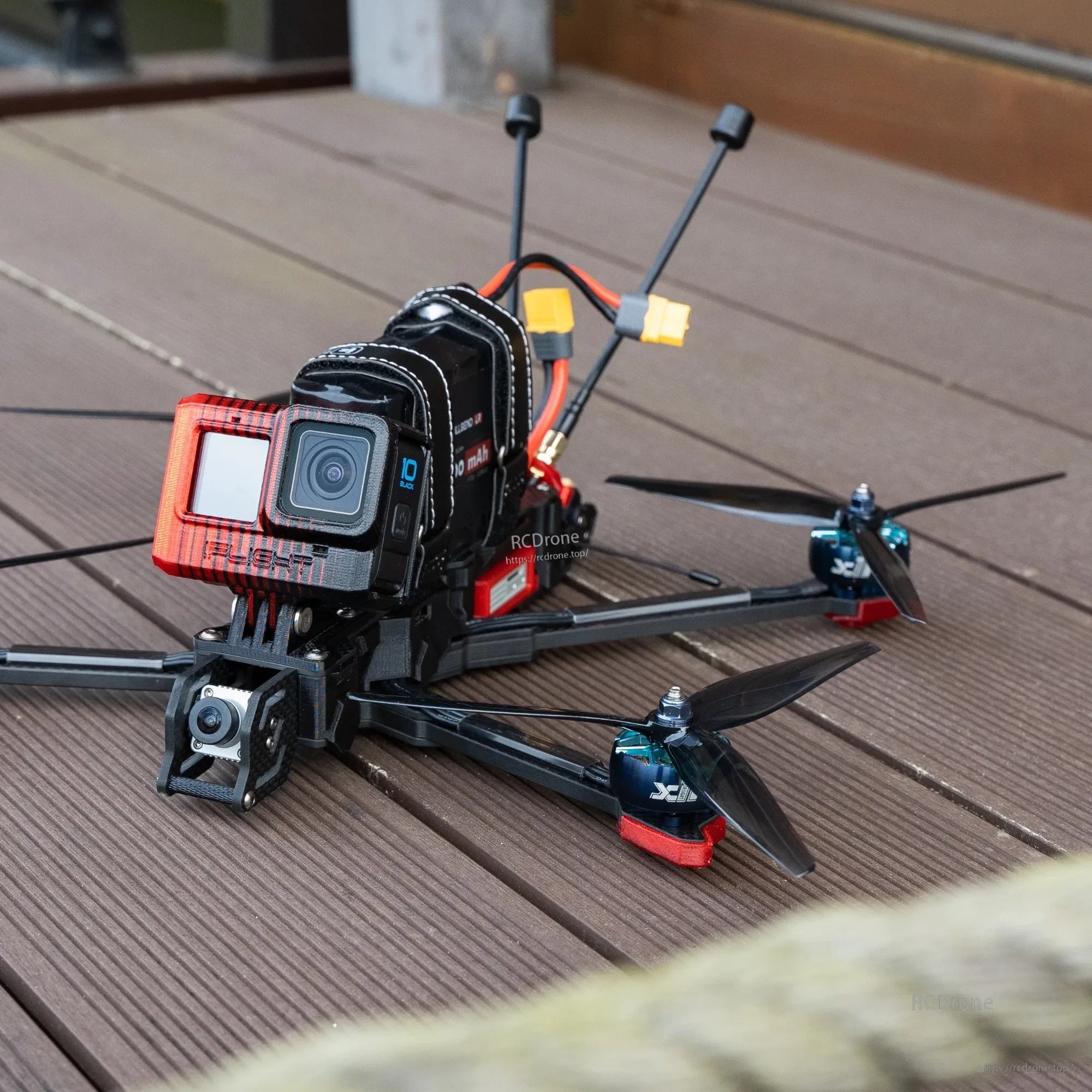 FPV quadcopter with 7.5-inch tri-blade propellers installed, set up for action camera flying
